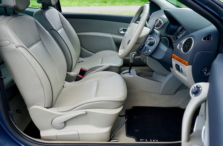 Close view of a car door armrest and storage pocket