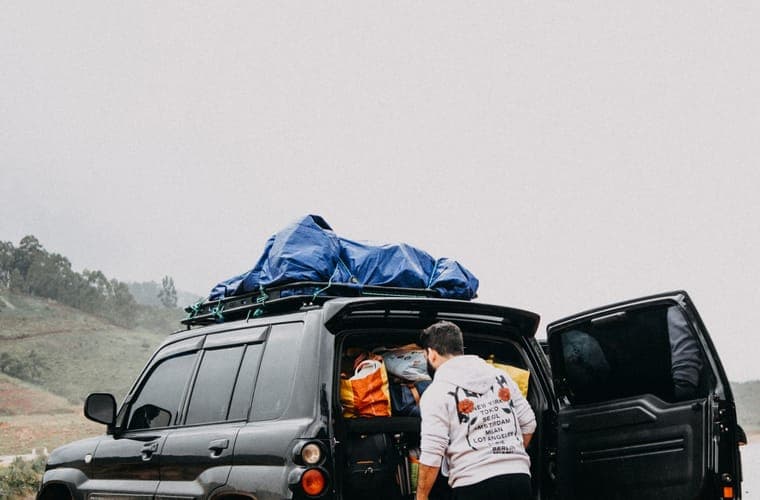 Loading luggage into an SUV cargo bay